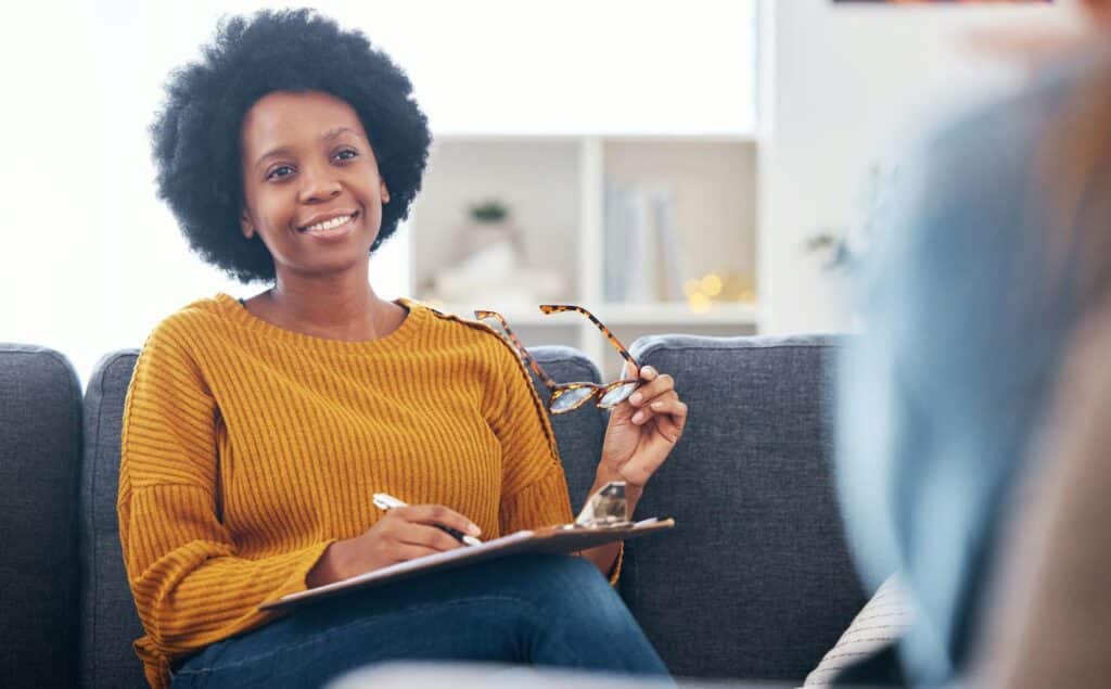 Smiling therapist leading a CBT session in Nashville.