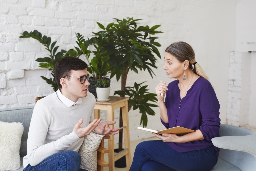 Man speaking with counselor during DBT in Nashville therapy session