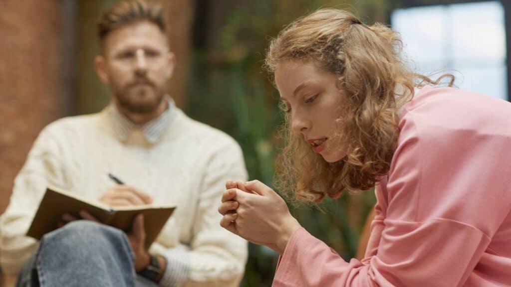 Woman discussing personal challenges with a therapist during individual therapy in Nashville.