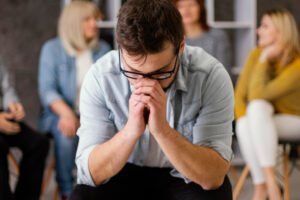 Man participating in a group therapy session during kratom addiction treatment in Nashville, TN at Nashville Wellness.