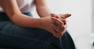 Woman coping with anxiety during a counseling session at a women's addiction treatment center in Nashville Wellness.