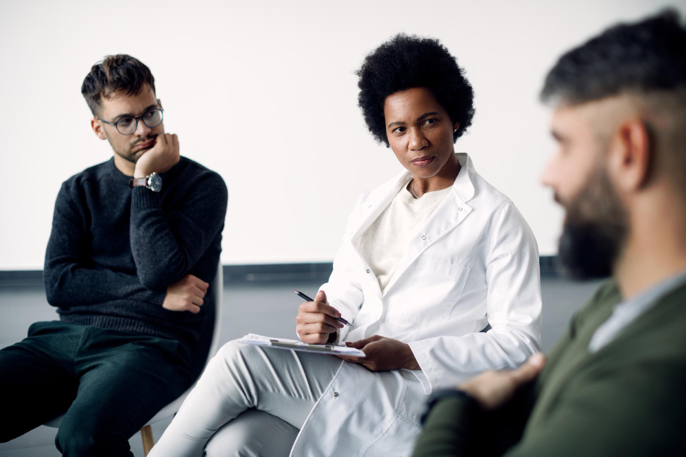 Psychotherapist leading a group therapy session during cocaine addiction treatment in Nashville, TN at Nashville Wellness.