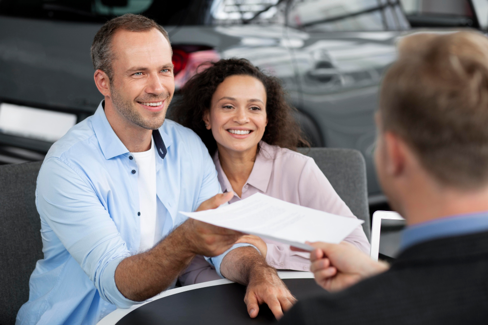 Couple receiving insurance paperwork authorizing treatment at a rehab that accepts BCBS in Nashville, TN.