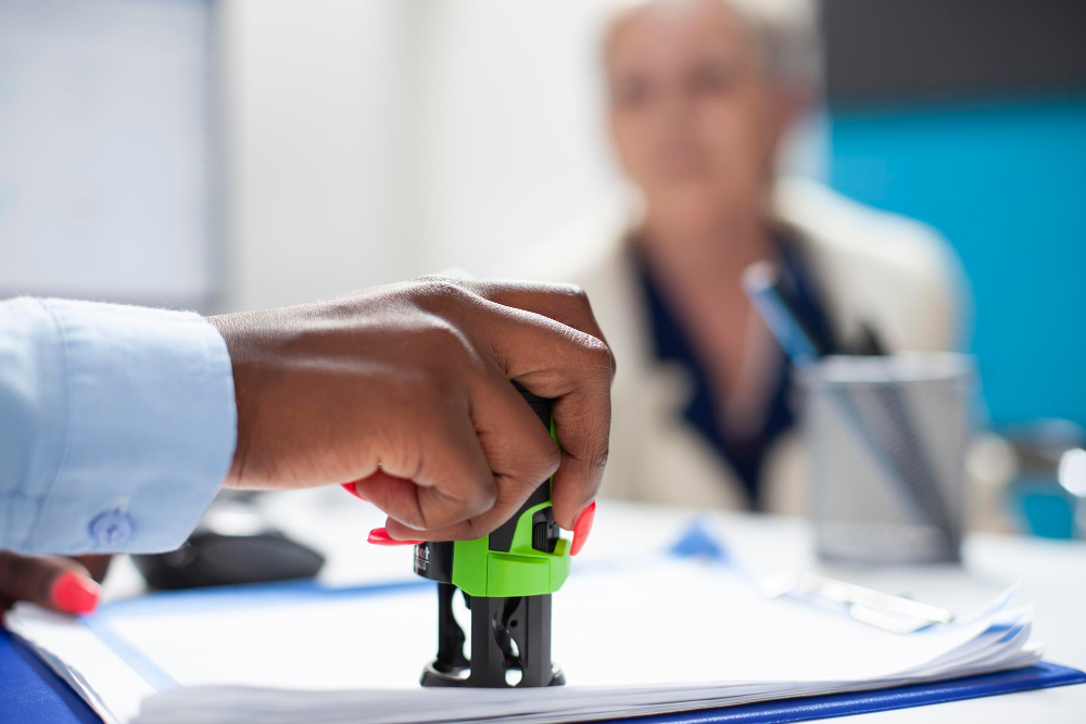 Doctor approving insurance documentation for addiction treatment.